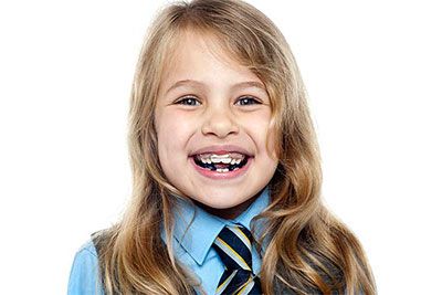 Smiling kid in tie with Braces
